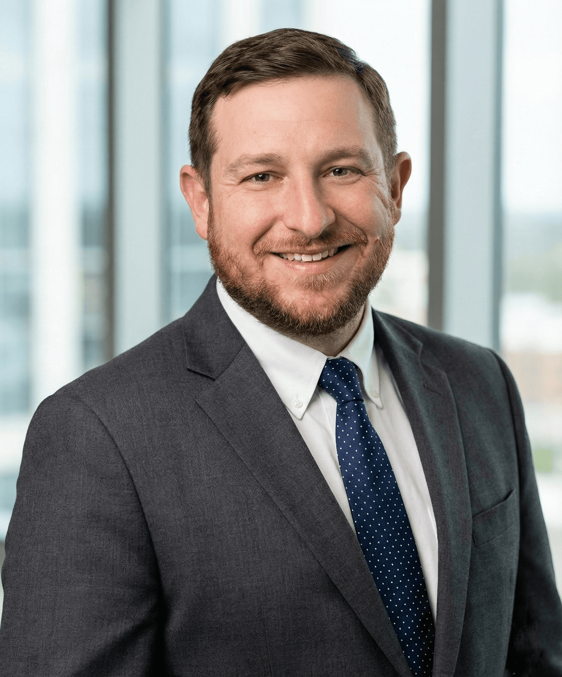 Kelvin, Principal of Liberty Gold Silver, seated at the desk